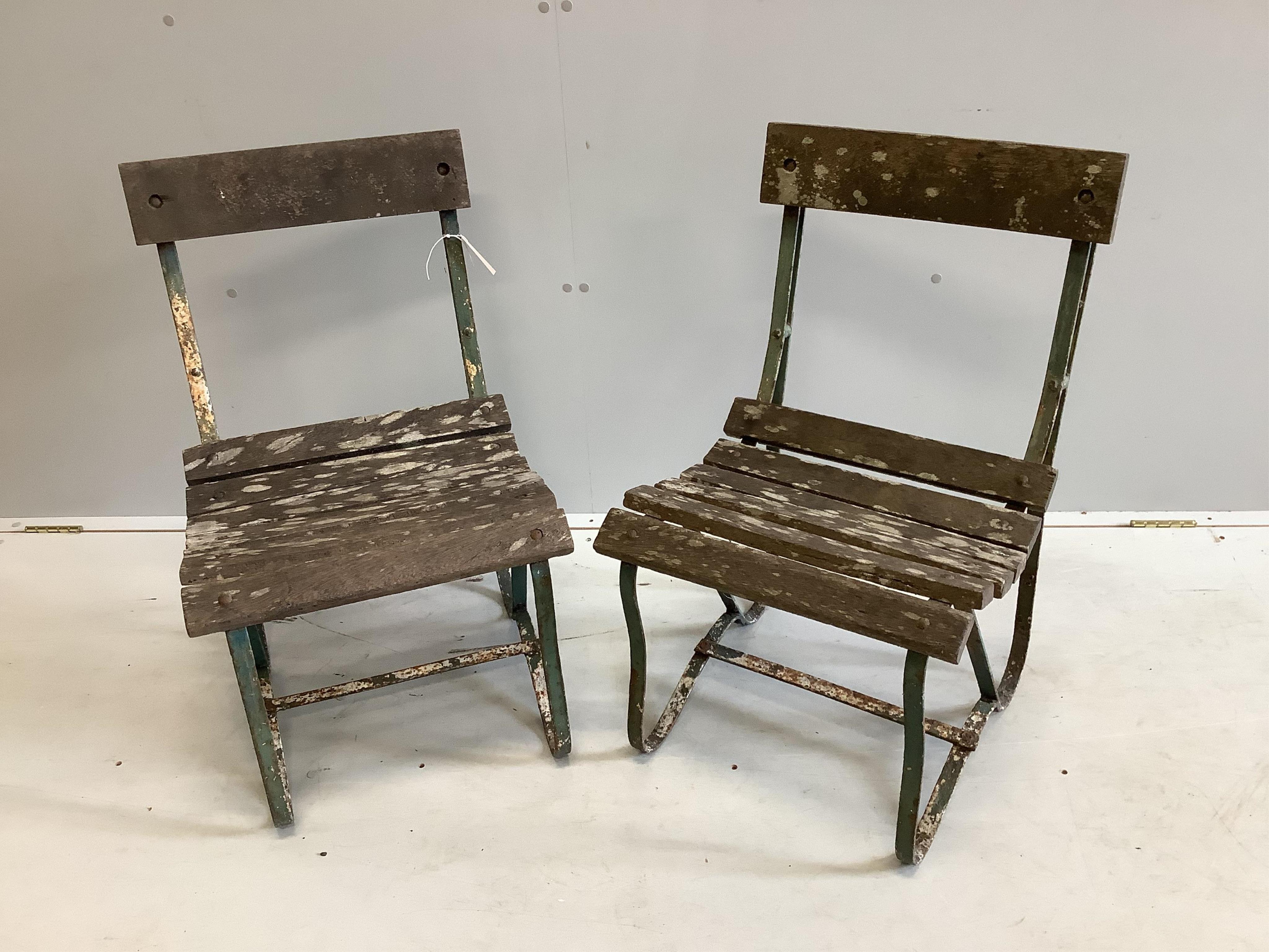 A pair of vintage slatted wrought iron garden chairs, width 45cm, depth 45cm, height 76cm. Condition - fair